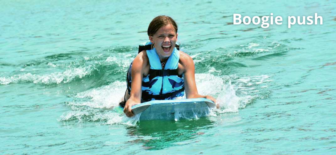 man smiling with a dolphin in punta cana
